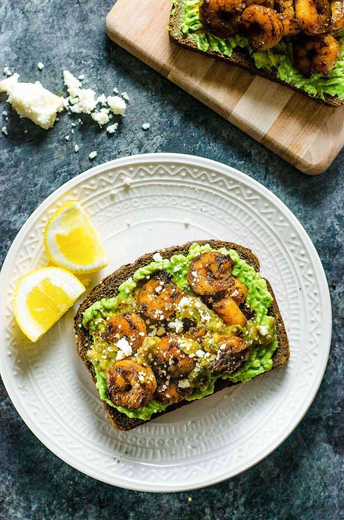 Spicy Cajun Shrimp and Avocado Toast -  a quick, light and delicious weekday lunch or weekend brunch for those busy days! Creamy Avocado Toast topped with backened Cajun spiced shrimp, salsa verde and Cojito. 