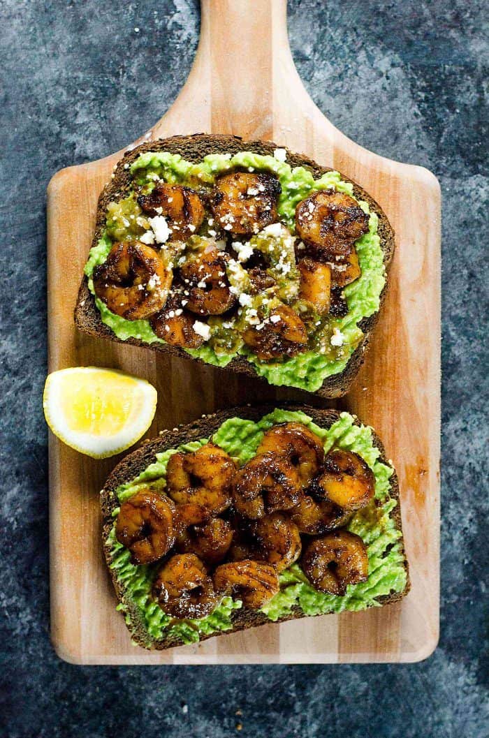 Spicy Cajun Shrimp and Avocado Toast -  a quick, light and delicious weekday lunch or weekend brunch for those busy days! Creamy Avocado Toast topped with backened Cajun spiced shrimp, salsa verde and Cojita