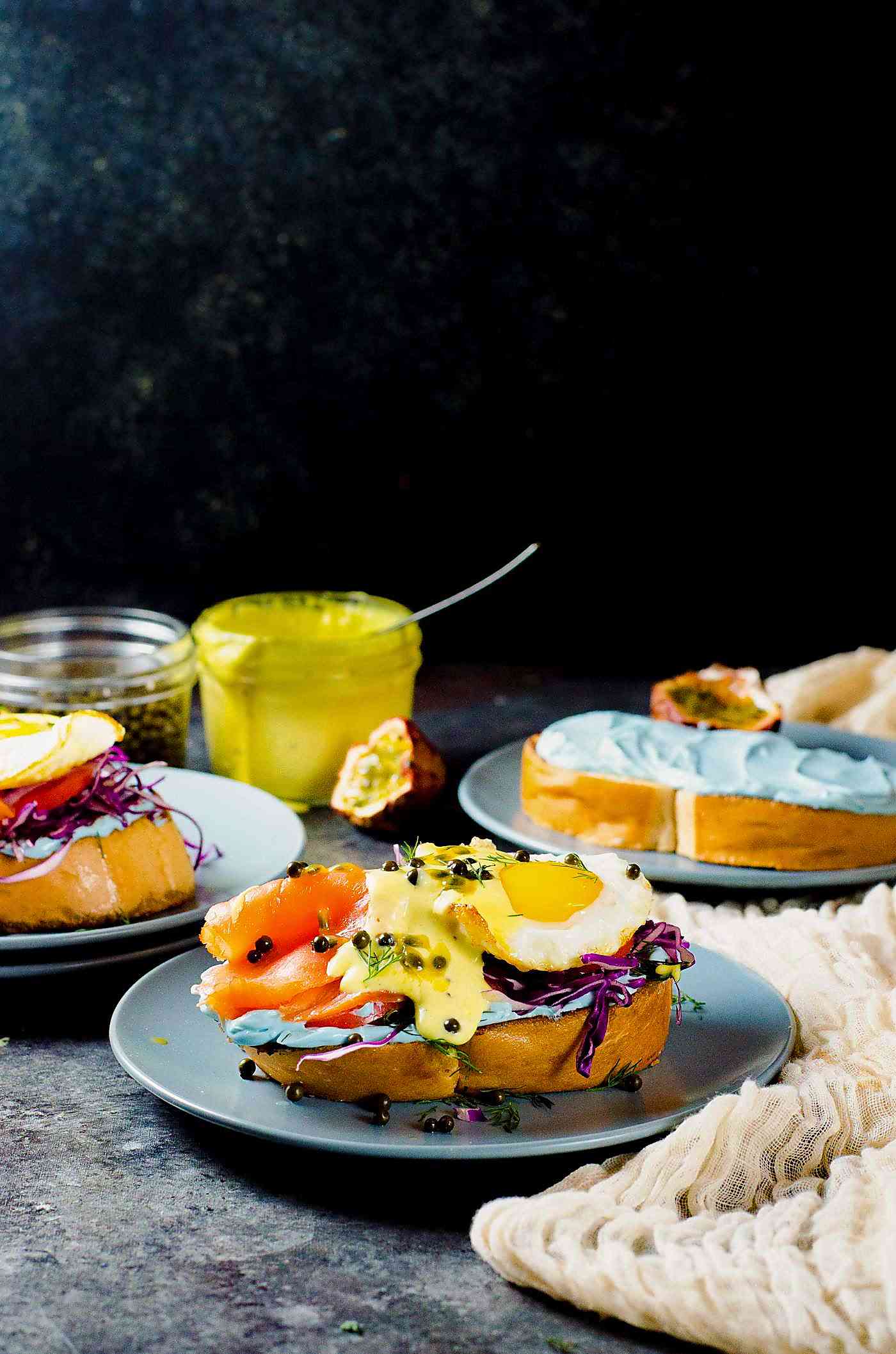 Smoked Salmon Toast with Passion fruit Hollandaise Sauce - A fun and colorful breakfast or brunch recipe for the whole family. All natural rainbow colored twist for Salmon Toasts, topped with a Blender made Passion fruit Hollandaise Sauce.