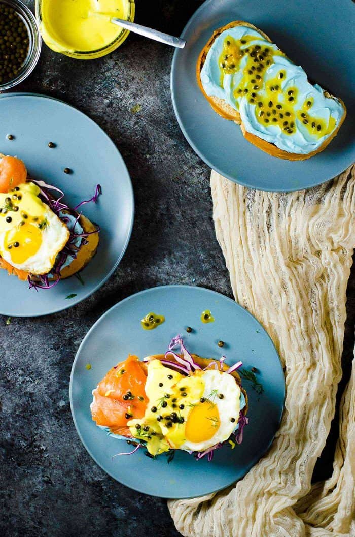 Smoked Salmon Toasts with Passion fruit Hollandaise Sauce - A fun and colorful breakfast or brunch recipe for the whole family. All natural rainbow colored twist for Salmon Toasts, topped with a Blender made Passion fruit Hollandaise Sauce.