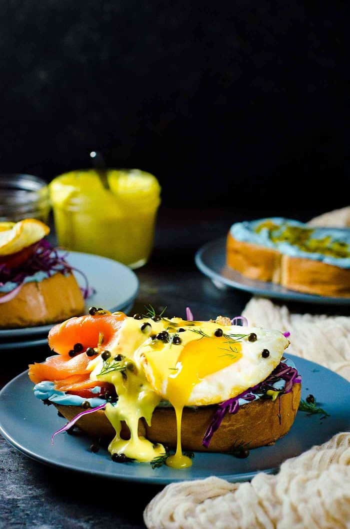 Smoked Salmon Toasts with Passion fruit Hollandaise Sauce - A fun and colorful breakfast or brunch recipe for the whole family. All natural rainbow colored twist for Salmon Toasts, topped with a Blender made Passion fruit Hollandaise Sauce.
