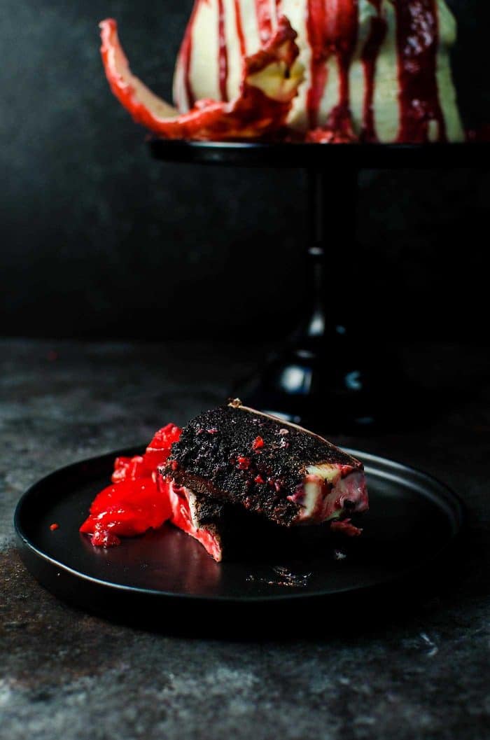 Boozy Chocolate Skull Cake with Strawberry Jello Brain and Red Velvet blood sauce - Perfectly gruesome and delicious Halloween Cake! Melt the White chocolate skull to reveal the secret Jello Brain hidden inside!