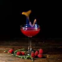 Flaming Dragon's Blood Cocktail - Thyme and Raspberry Daiquiri for parties. A showstopping flaming Halloween Cocktail made with raspberries and thyme. 