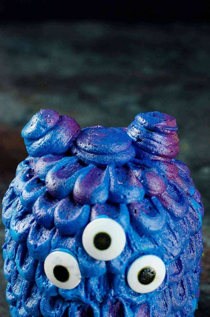 Dragon Monster Cake with buttercream scales - Mini Monster Cakes (Halloween Cakes) - Airbrushed with purple color and silver luster paint to give the cake a dual color sheen.