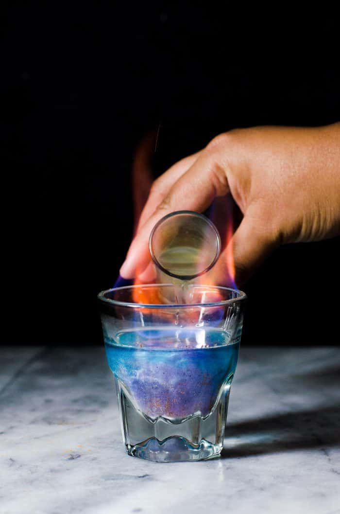 Phoenix Cocktail - An Gin and Elderflower Cocktail that is a Color Changing Shimmery Cocktail! Made with Butterfly pea Flower infused gin and a fruity, tangy, floral and sweet lemon Elderflower syrup. 