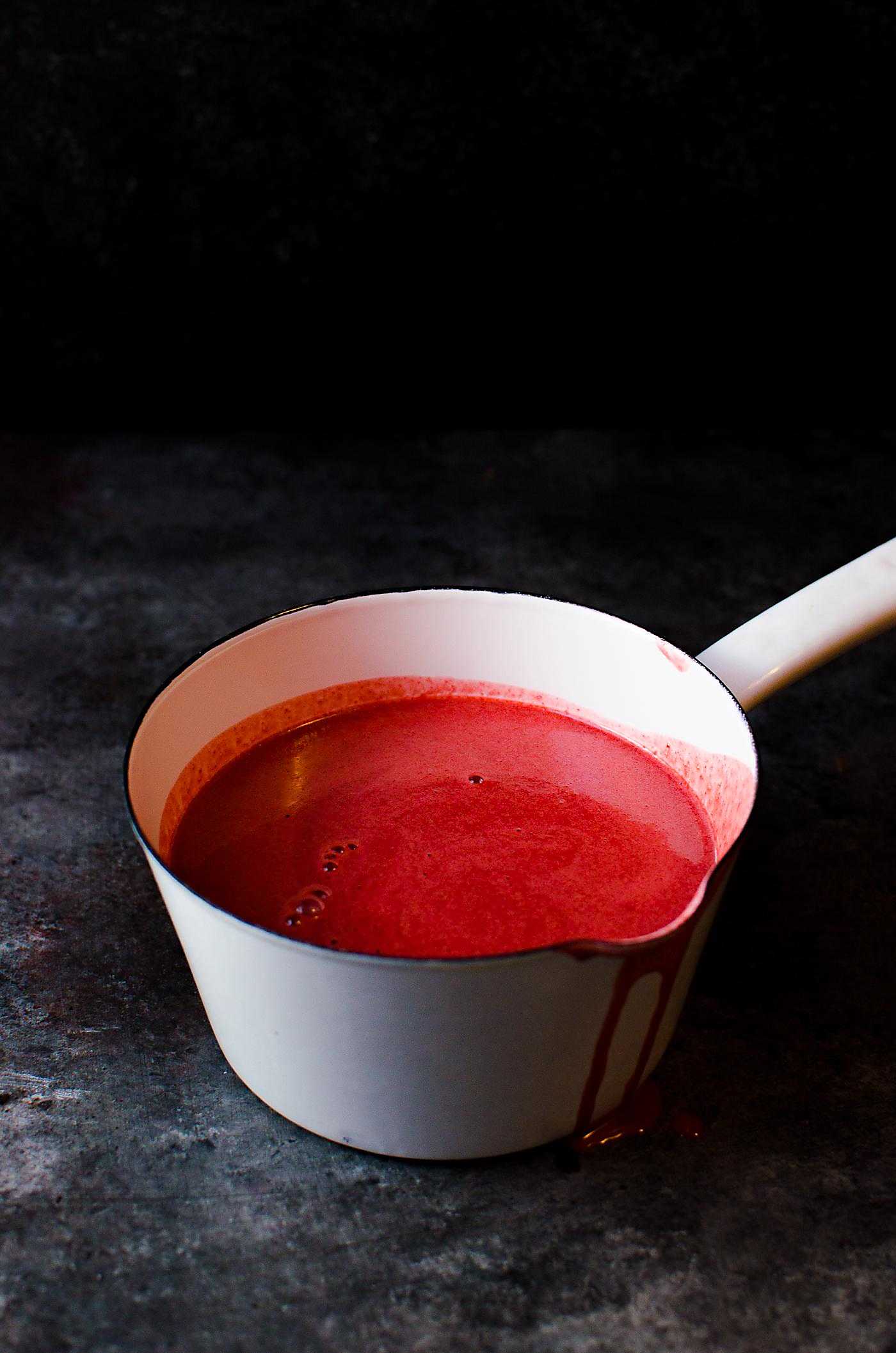 Red Velvet Creme Anglaise (or Red Velvet Pouring Custard) - Thick, creamy and luscious with lovely bittersweet chocolate and vanilla flavor. A great pouring custard to pair with your desserts, and works just as well as a Bloody Custard Sauce for Halloween-worthy treats!