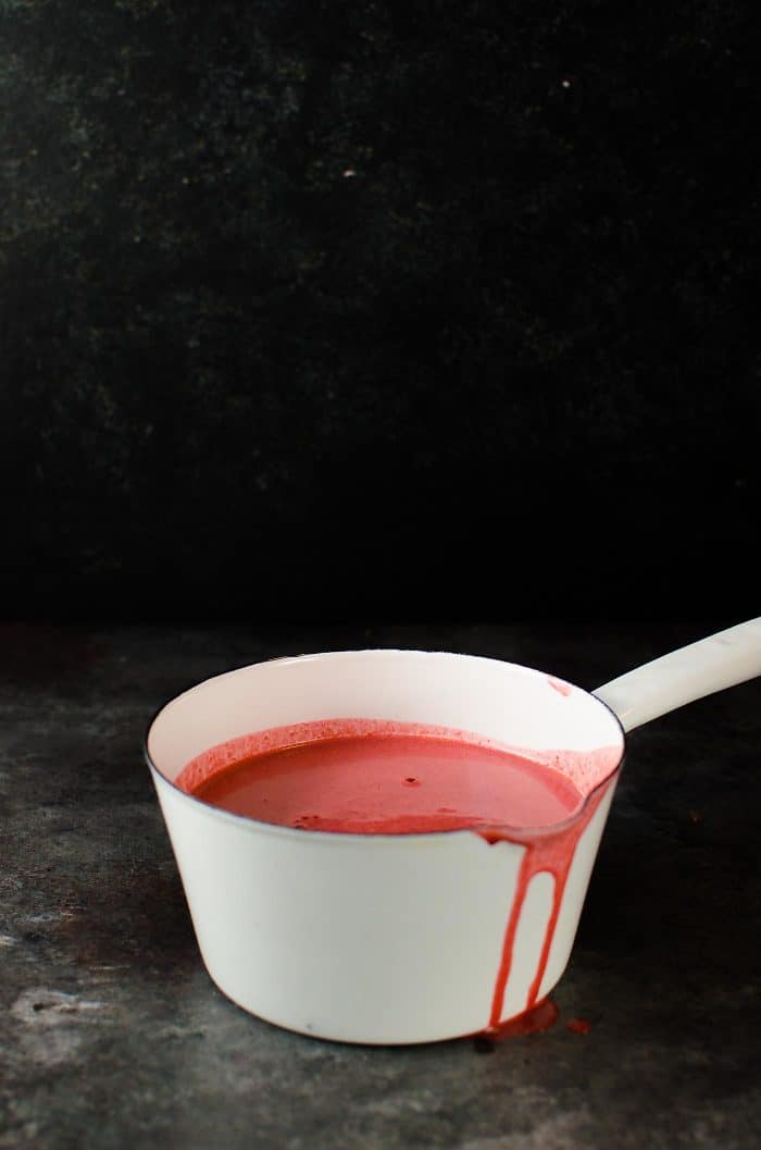 Red Velvet Creme Anglaise (or Red Velvet Pouring Custard) - Thick, creamy and luscious with lovely bittersweet chocolate and vanilla flavor. A great pouring custard to pair with your desserts, and works just as well as a Bloody Custard Sauce for Halloween-worthy treats!