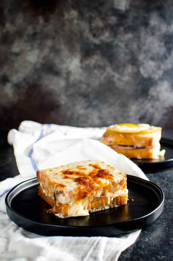 Turkey Croque Monsieur or Croque Madame - A delicious twist on the classic French sandwich. The perfect way to use up Thanksgiving leftovers too. A cheesy Ham and cheese sandwich with cranberry mustard sauce and Turkey, slathered in Bechamel Sauce. 
