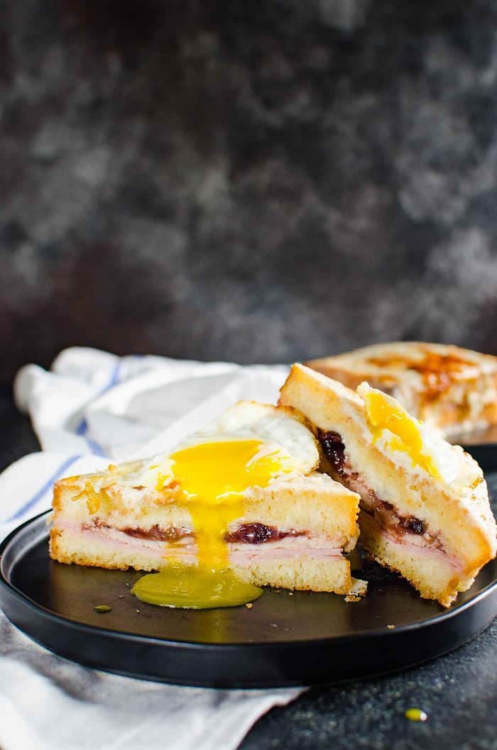 Turkey Croque Monsieur or Croque Madame - A delicious twist on the classic French sandwich. The perfect way to use up Thanksgiving leftovers too. A cheesy Ham and cheese sandwich with cranberry mustard sauce and Turkey, slathered in Bechamel Sauce. 