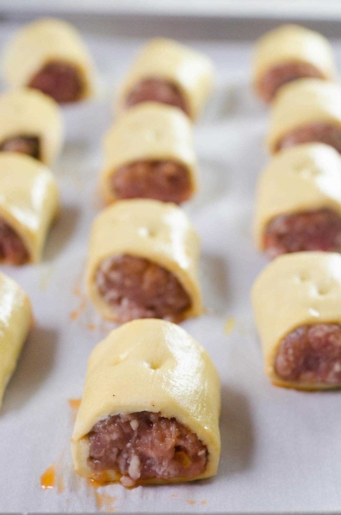 Easy Sausage rolls - These are perfect to make ahead too. Freeze these, BEFORE adding an egg wash and keep them in the freezer. They can be quickly baked when you have company or need a snack!