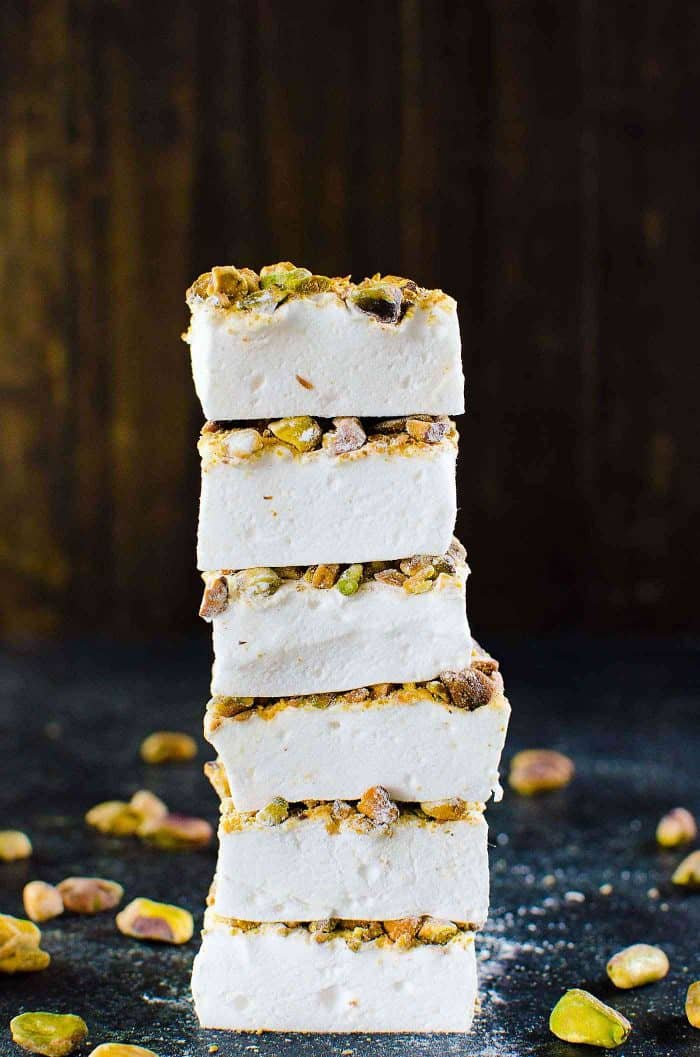 Orange blossom Marshmallows with Pistachios - Fluffy, melt in your mouth homemade Marshmallows made with no corn syrup and so easy to make too! Flavored with exotic orange blossom water and roasted pistachios, these are perfect for gift giving for Christmas or any holiday. 
