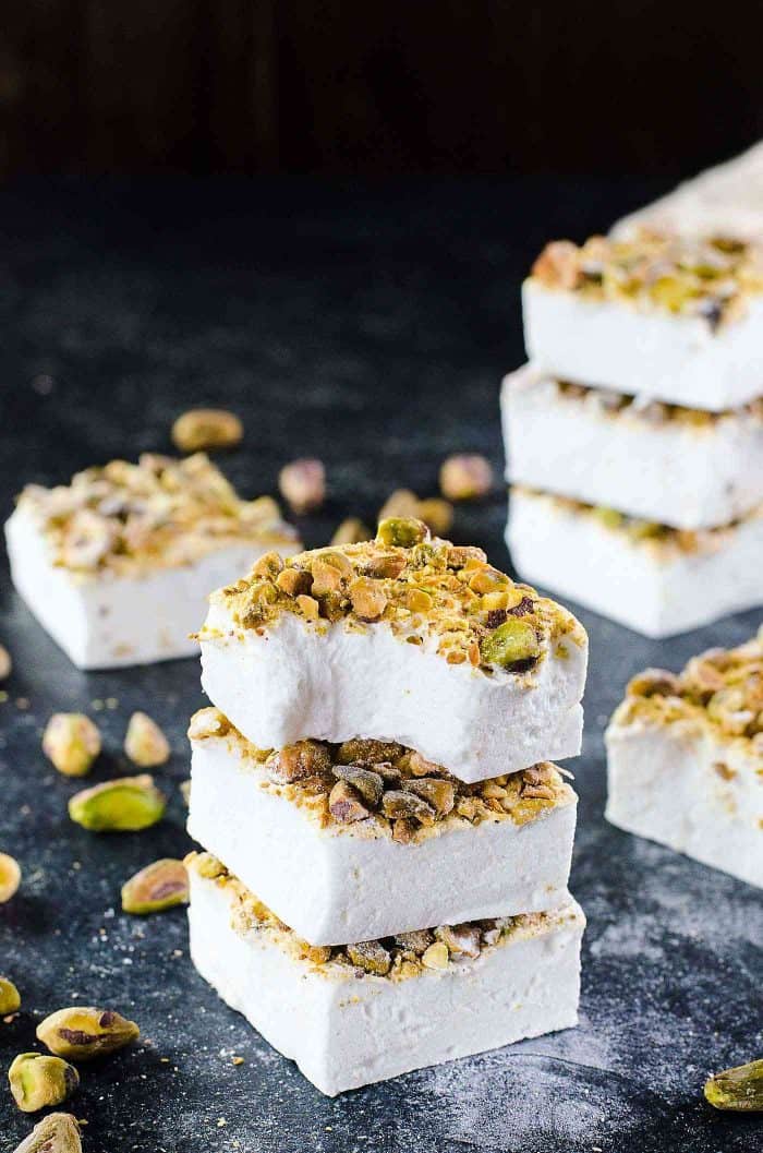 Orange blossom Marshmallows with Pistachios - Fluffy, melt in your mouth homemade Marshmallows made with no corn syrup and so easy to make too! Flavored with exotic orange blossom water and roasted pistachios, these are perfect for gift giving for Christmas or any holiday. 