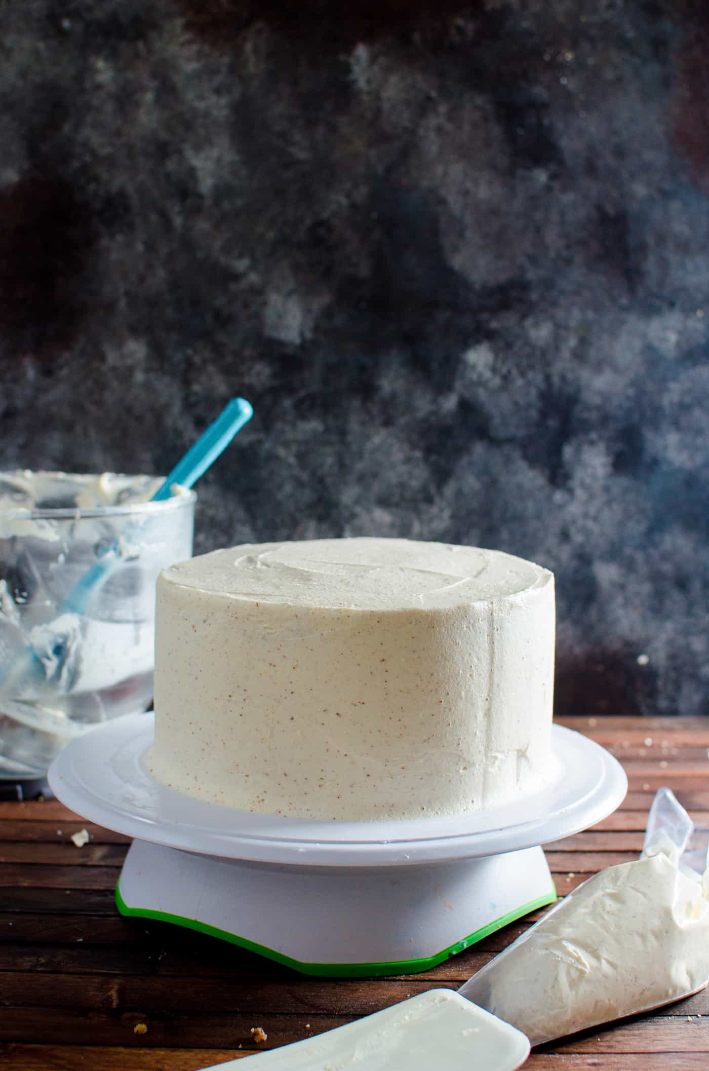 Spiced Bourbon Butter Pecan Cake with Brown Butter Maple Frosting - A fall cake that's perfect for thanksgiving dessert.  Flavors of a pecan pie in a cake with nutty, sweet and spiced flavors. 