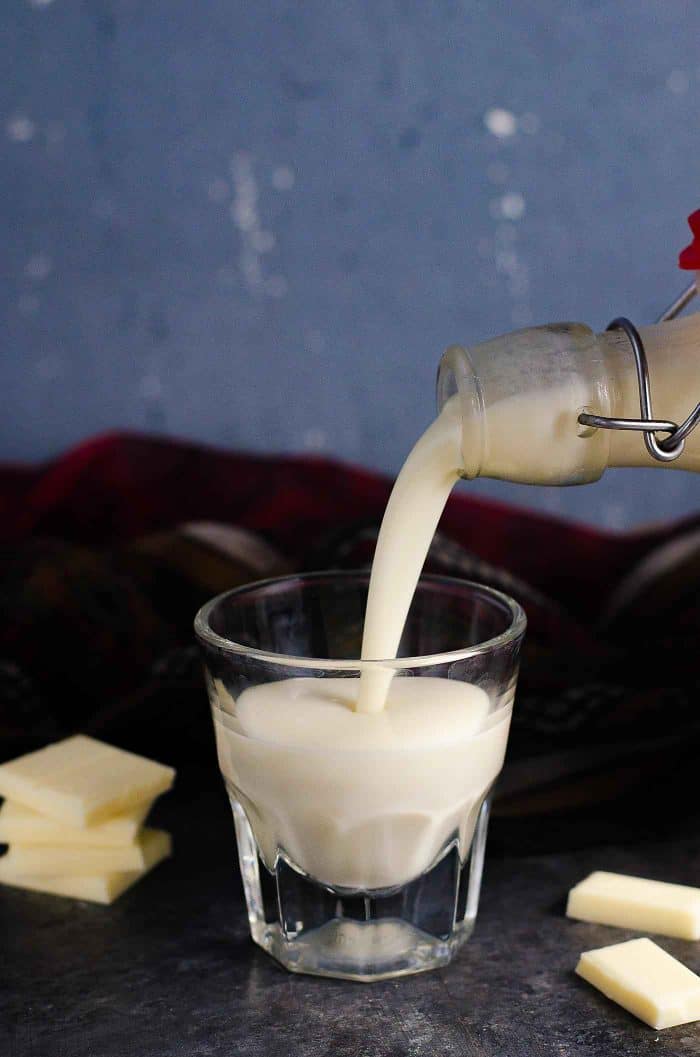 The BEST homemade white chocolate liqueur that is so easy to make, and absolutely delicious with extra white chocolate flavor! It's NOT sickly sweet, but still has the creamy taste of white chocolate! Far better than store bought too.