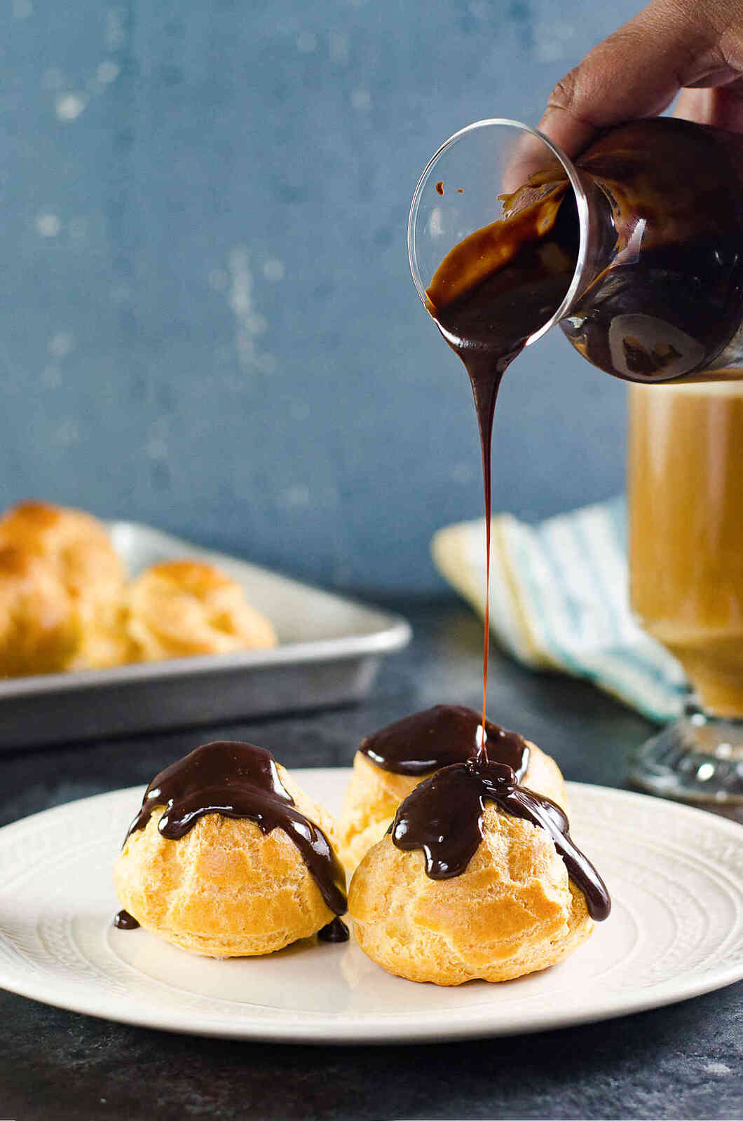 Chocolate Profiteroles with Pastry Cream (Cream Puffs) - rich, creamy custard filling inside light, airy, crispy, perfectly baked choux pastry shells, and then drizzled with a luscious chocolate sauce on top. 