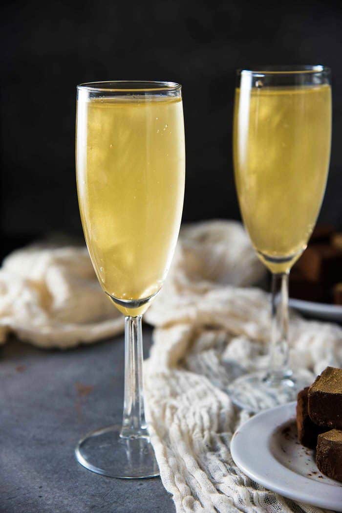 Gold Shimmery Champagne Cocktail - an easy shimmery New Year's Eve Cocktail that is perfect as any celebration cocktail. Get the recipe for this floral and bubbly, elderflower champagne cocktail with non alcoholic options too. 