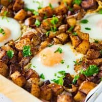 Sheet pan Breakfast Potatoes with Bacon and Eggs - This oven roasted breakfast potatoes and eggs with crispy bacon bits, are all cooked in the same sheet pan so you can enjoy your weekend mornings without standing over the stove.