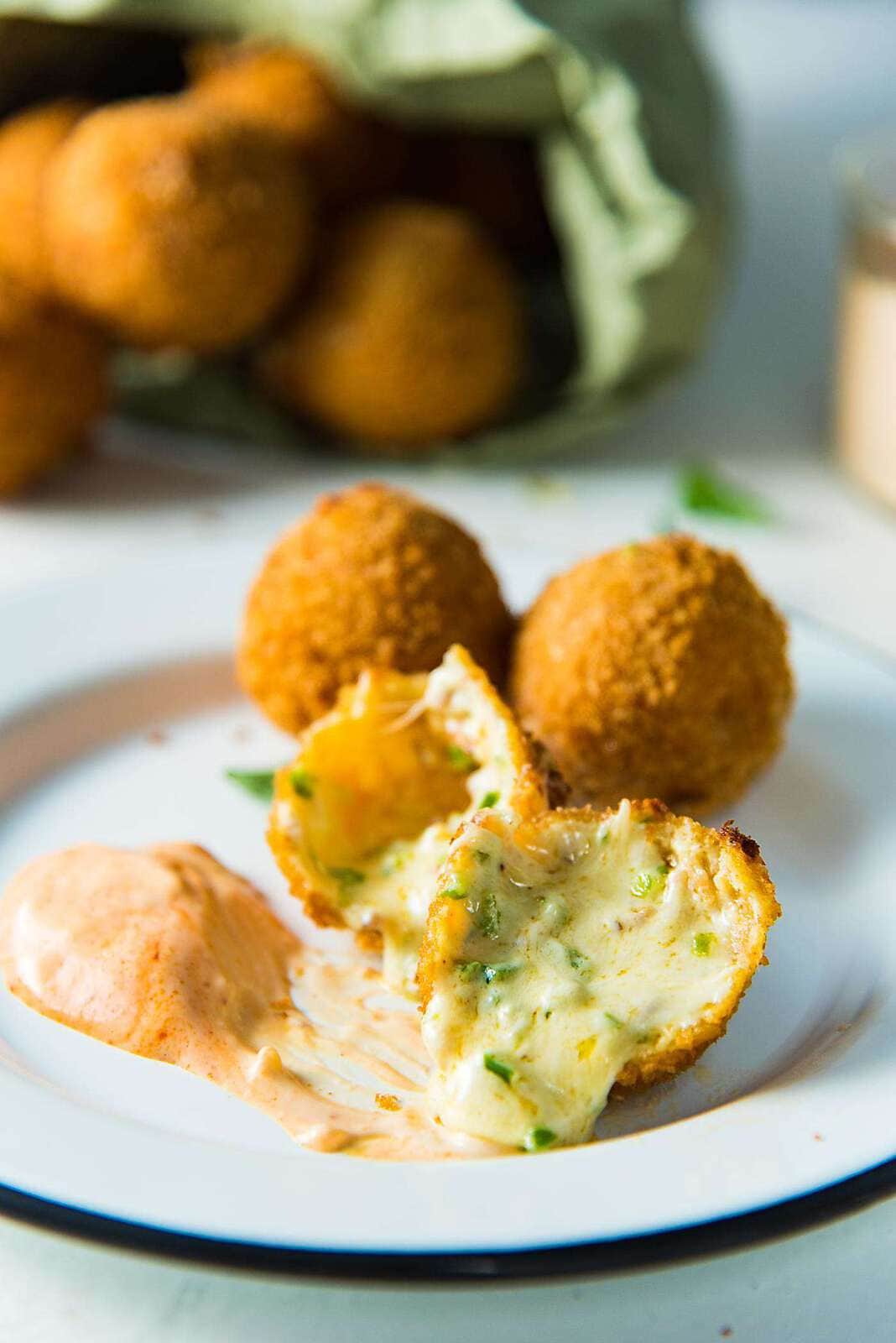 Crispy Cheese Jalapeno Bacon Bites - These creamy, crunchy, flavorful fried cheese balls are perfect for game day snacking or as any party appetizer! Like Bacon Jalapeno Poppers, but even better!