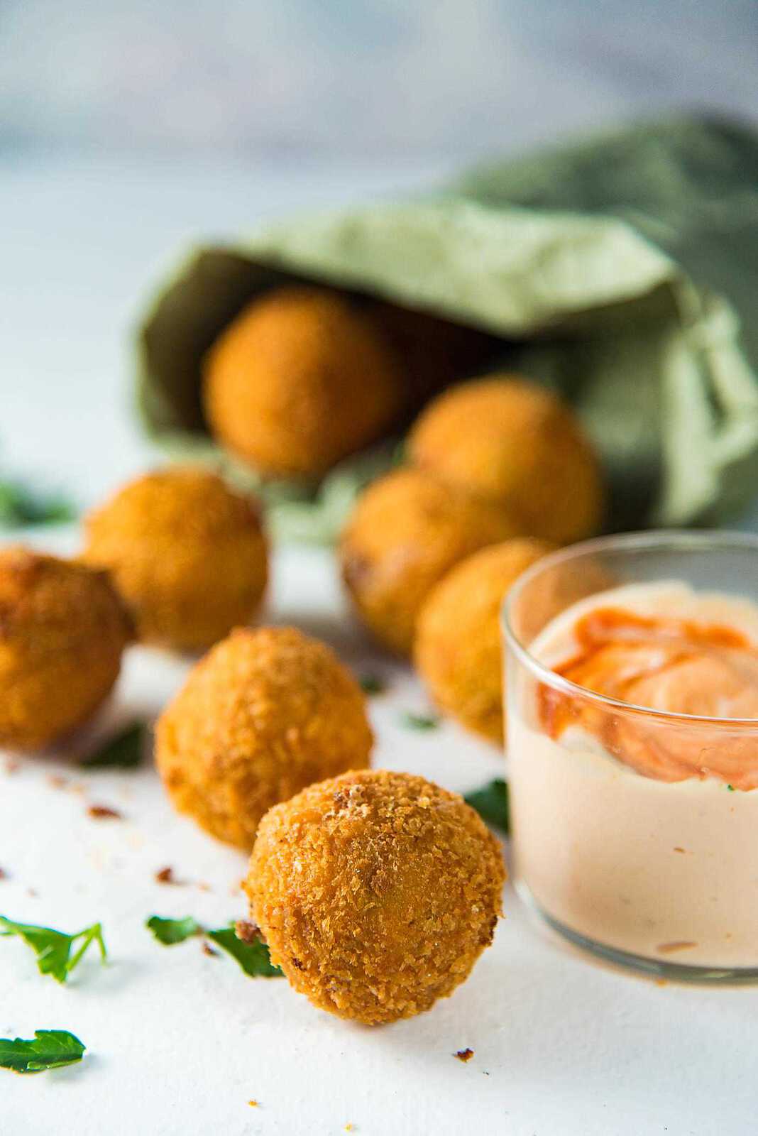 Crispy Cheese Jalapeno Bacon Bites - These creamy, crunchy, flavorful fried cheese balls are perfect for game day snacking or as any party appetizer! Like Bacon Jalapeno Poppers, but even better!