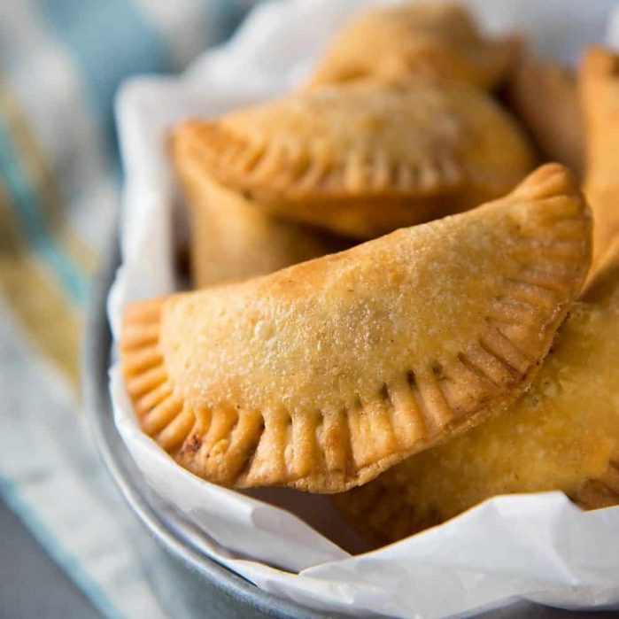 Sri Lankan Fish Patties - These fish empanadas are epic! A spicy fish filling inside perfectly flaky buttery crust. Perfect for snacking. Step by step instructions to make these Sri Lankan Patties. Freezer friendly too.