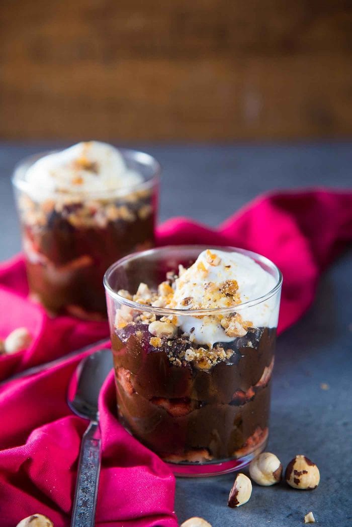 Chocolate Hazelnut Trifle - Layers of silky smooth hazelnut liqueur flavored chocolate mousse, and hazelnut liqueur soaked ladyfingers, topped with crunchy hazelnut praline and whipped cream