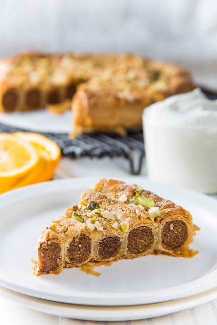 Citrus, Date and Almond M’hencha with Orange blossom honey syrup - Slice the cake into wedges and serve with whipped cream as a dessert or an afternoon tea treat. 