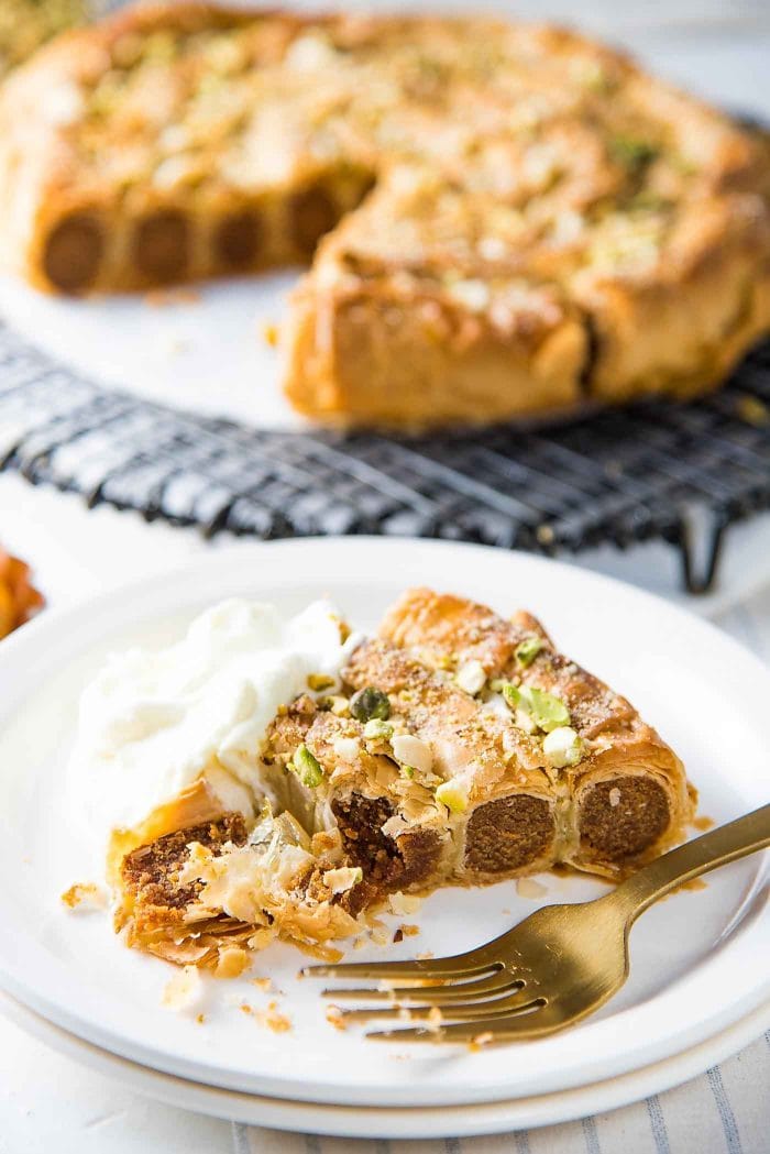 Citrus, Date and Almond M'hencha - Orange blossom honey soaked, layers of flaky filo pastry. With a delicious, date sweetened citrus almond paste filling. See how flaky the filo pastry layers are!