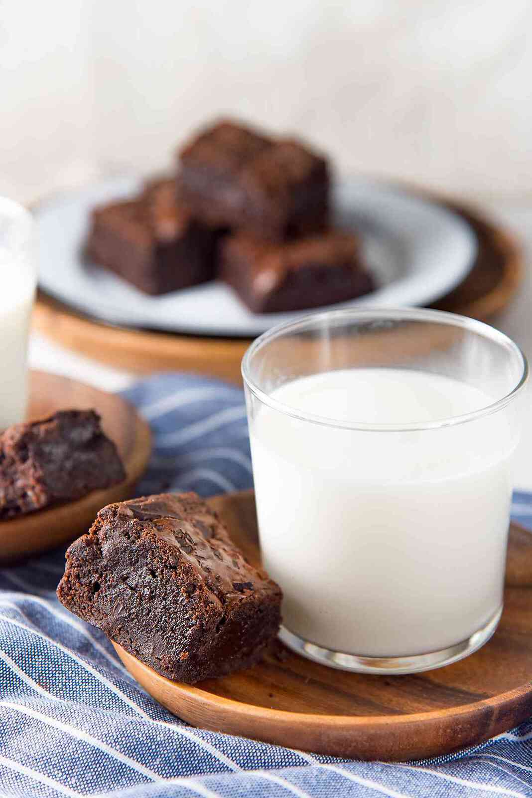 The Best Fudgy Chocolate Brownies - These fudgy brownies are made with cocoa powder with chunks of real chocolate in the brownies. With detailed tips on how to make perfect fudgy cocoa brownies. Perfect with a glass of milk.