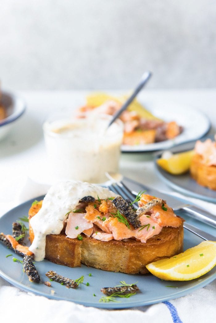 Egg in a hole with Salmon - Serve these buttery toast with spicy tartar sauce with jalapeno and cayenne pepper and chopped herbs.