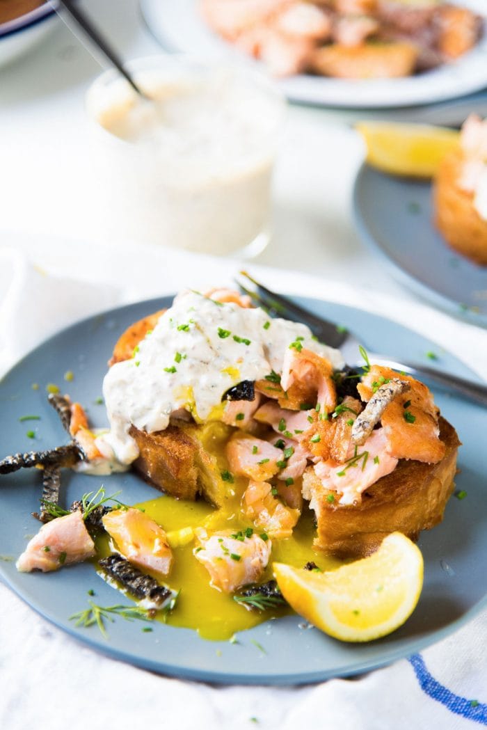Egg in a hole with Salmon - Warm, buttery toast with a rich runny egg in a hole, and topped with salmon and crispy skin. A delicious brunch or breakfast recipe and a great way to use leftover salmon. 