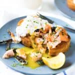 Egg in a hole with Salmon - Warm, buttery toast with a rich runny egg in a hole, and topped with salmon and crispy skin. A delicious brunch or breakfast recipe and a great way to use leftover salmon.