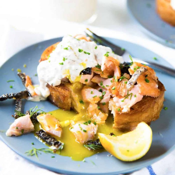 Egg in a hole with Salmon - Warm, buttery toast with a rich runny egg in a hole, and topped with salmon and crispy skin. A delicious brunch or breakfast recipe and a great way to use leftover salmon. 