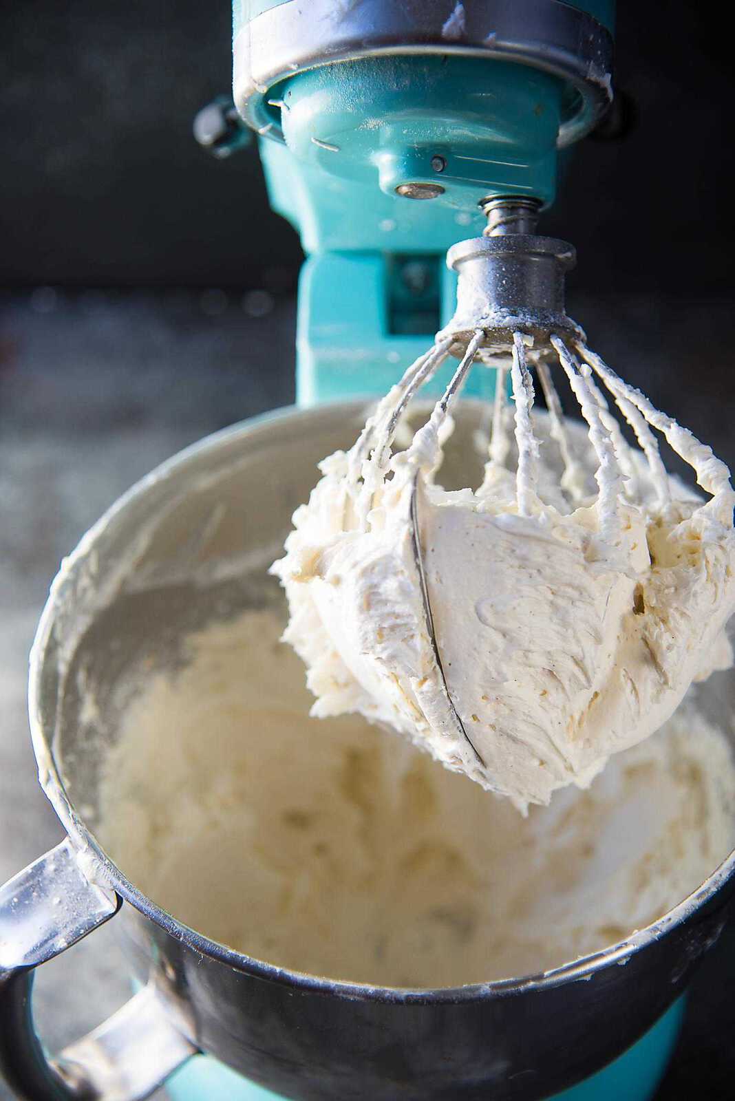 A close up showing the creamy fluffy consistency of whipped butter to make buttercream. 