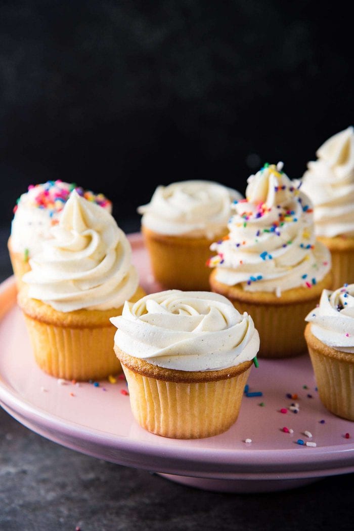 Creamy vanilla buttercream frosting swirled like a rose ontop of a cupcake. The frosting holds its shape but is still creamy and soft. 