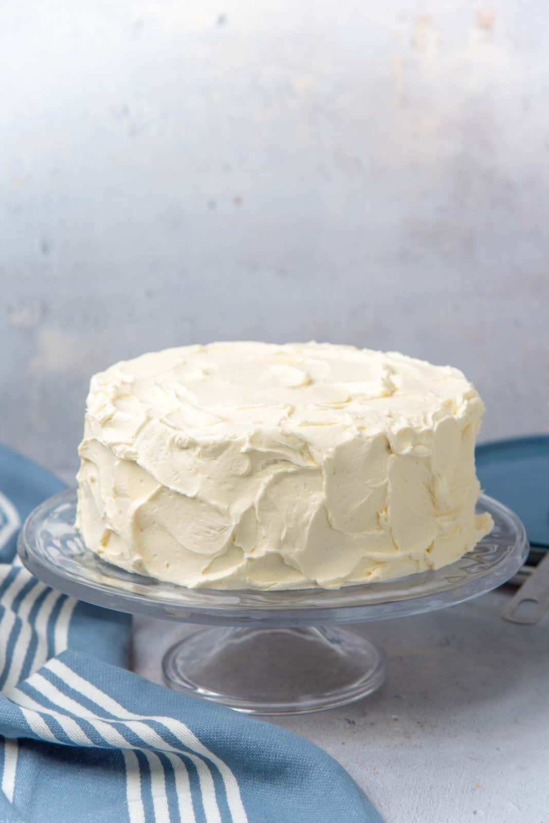 A rustic vanilla cake with swirled vanilla buttercream