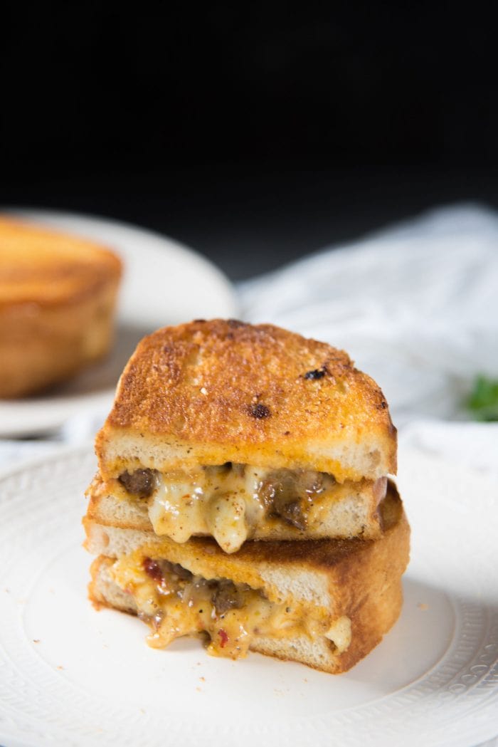 Curried Beef Grilled Cheese Sandwich - A delicious grilled curry cheese cut in half with gooey, melted cheese filling with spicy beef.