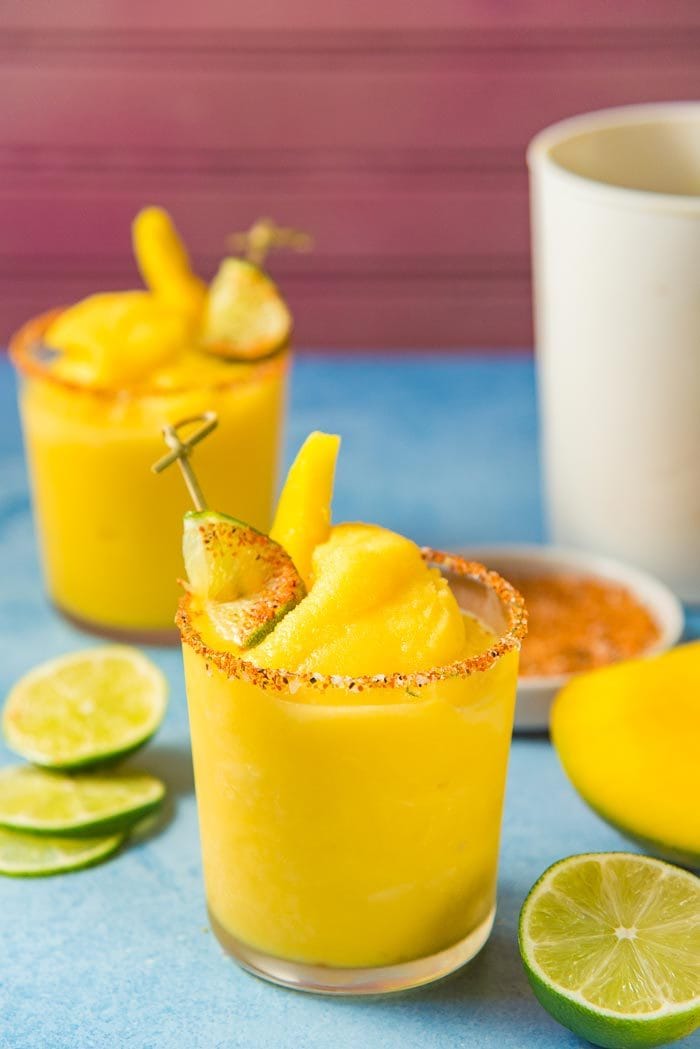 Frozen Mango Margarita -  a creamy, sorbet like, fruity and refreshing frozen margarita with a spicy lime chili salt ring to kick it up another notch!