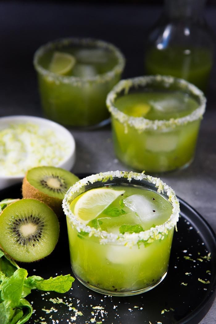 Mint Kiwi Margarita - A delicious margarita with tangy kiwi fruit, and refreshing mint! Perfect Summer sipper. Make individual cocktails or a batch mint kiwi margarita punch!
