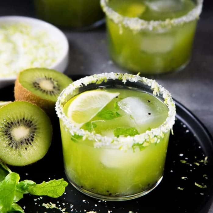 Mint Kiwi Margarita - A delicious margarita with tangy kiwi fruit, and refreshing mint! Perfect Summer sipper. Make individual cocktails or a batch mint kiwi margarita punch!