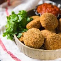Baked Fish Cutlets - A healthier alternative to deep-fried fish cutlets (fish croquettes). A spicy fish filling coated with a crispy and golden breadcrumb coating. Perfect for snacking. 