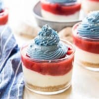 No Bake Coconut Strawberry Cheesecake Jars - There's no artificial coloring or flavoring in these mini desserts. The perfect pairing of coconut cheesecake and fresh strawberry pie filling makes these the perfect Fourth of July dessert!