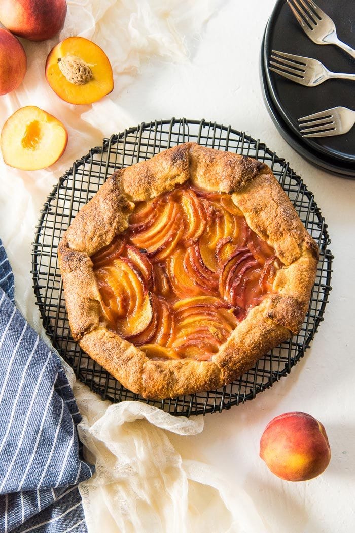 Easy Peach Galette - A delicious buttery pie crust, with a fresh, juicy peach filling! Fool proof, simple and easy summer dessert. 