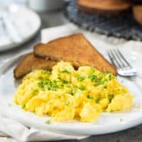 Creamy, Fluffy and perfect Scrambled Eggs in 1 minute - Learn how to make scrambled eggs at home with this fool proof recipe! Perfect for weekend brunch or week day breakfasts.