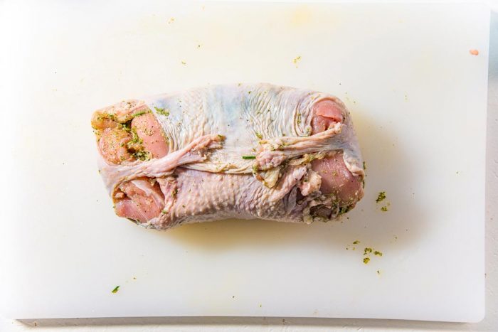 Once the turkey roulade is wrapped up in the skin tightly, make sure the seams of the skin and the meat is facing up. And the presentation side is down.