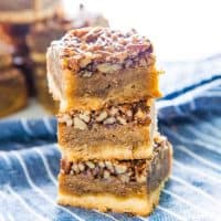 Fudgy Pecan Pie Bars - Classic Pecan pie, but as a bar or slice! A buttery shortbread crust and a fudgy flavorful pecan pie layer. A fantastic and easy dessert for Thanksgiving!