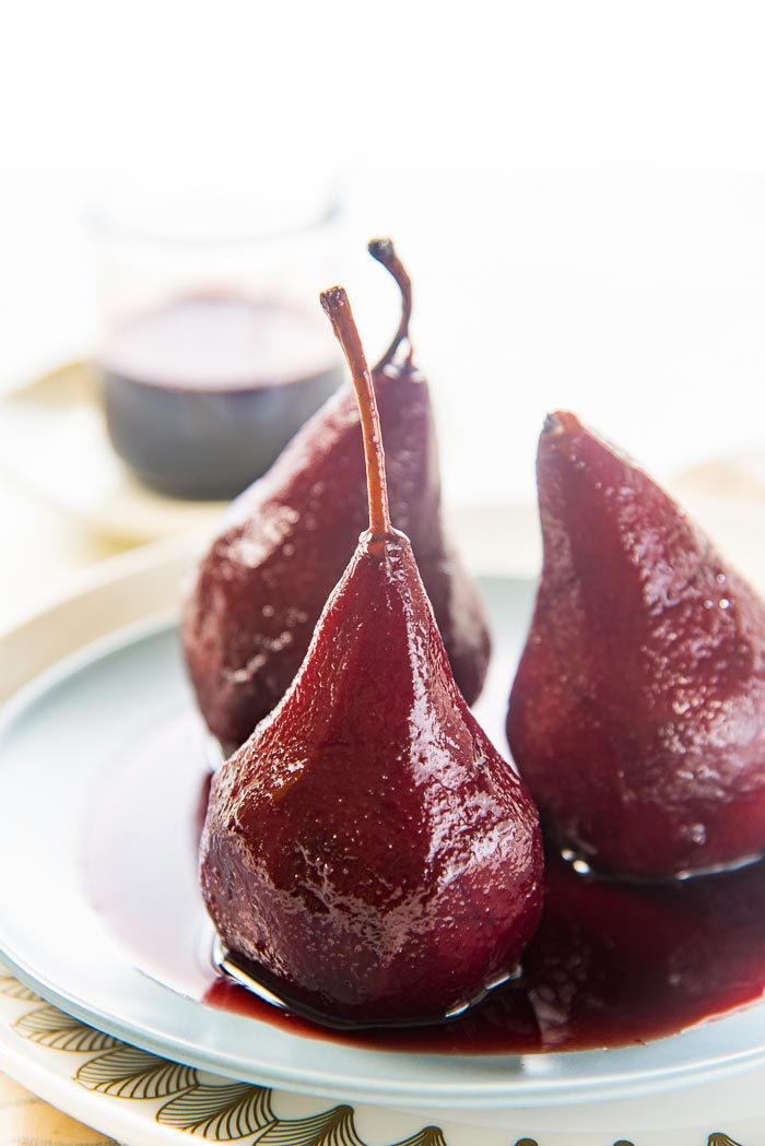 Red Wine Poached Pears - a simple and easy recipe that is absolutely elegant! Get tips to perfect this sweet and spiced simple pear dessert. 
