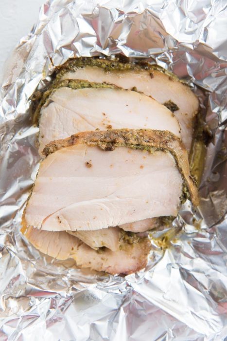 Slow roasted or slow cooker turkey breast slices on foil, for a foil packet. Best way to reheat leftover turkey for juicy leftovers.
