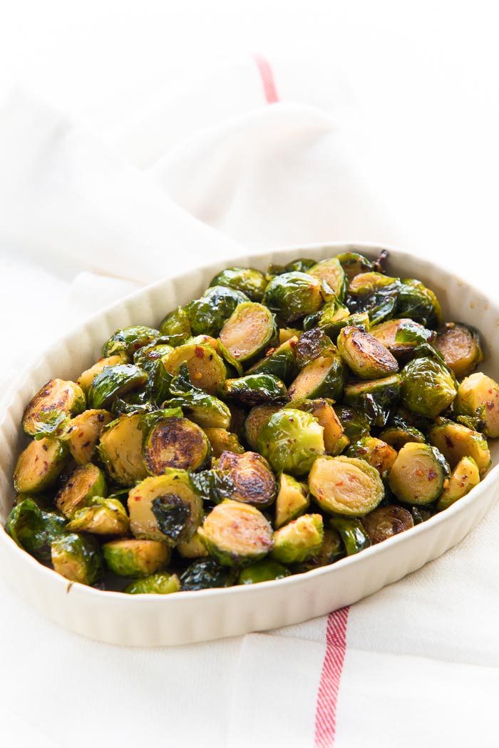 Oven roasted brussels sprouts one of many Thanksgiving side dishes, and easy to make. Serve with any roast. 