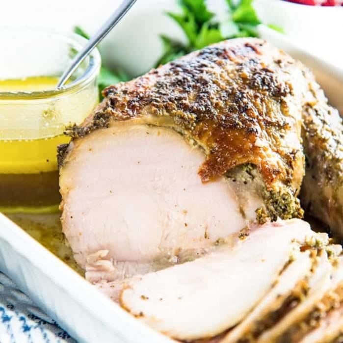 Slow Cooker Turkey Breast - A sage garlic butter flavored turkey breast roast, cooked to juicy perfection in the slow cooker! Perfect for Thanksgiving, holiday dinners or anytime you like to make a juicy roast. 