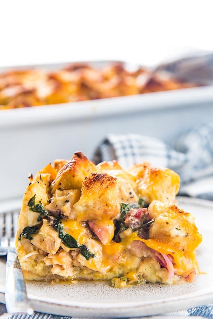 Thanksgiving Leftover Strata - Transform all your thanksgiving leftovers into this layered casserole with pockets of gooey cheese, cranberry sauce, turkey, french toast filling and gravy soaked croutons on top!